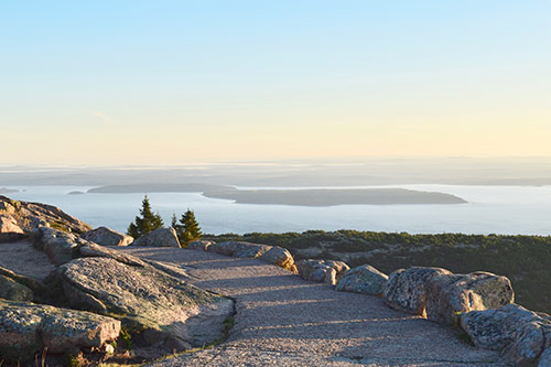 A serene rock path overlooking the sea.